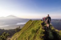 Hiking around the crater of Mount Batur with Mount Agung in the background