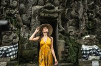 Beautiful woman in old hindu temple of Goa Gajah near Ubud on the island of Bali, Indonesia